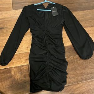 Stella Luce black form fitting mini long sleeve dress
